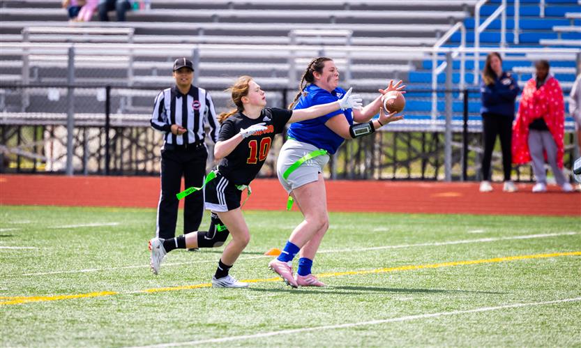 Girls play flag football